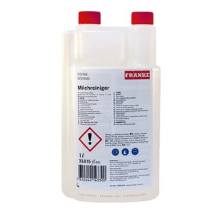 Le système de lait FRANKE - Nettoyant est présenté dans une bouteille avec bouchon rouge, affichant une étiquette comportant un texte multilingue et un symbole de danger. Sa capacité est de 1 litre (33,815 fl. oz.).